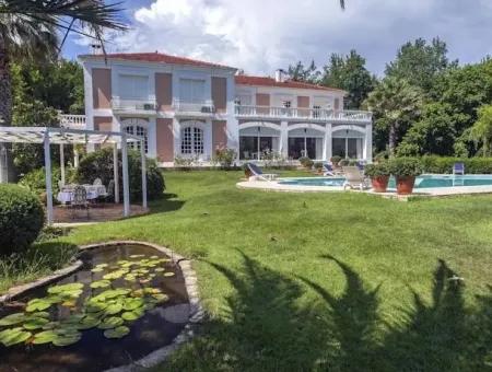 At A Distance Of 10 Km From The Centre Of Marmaris, Built With French Architecture Farm House Is For Sale.