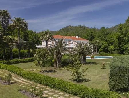 At A Distance Of 10 Km From The Centre Of Marmaris, Built With French Architecture Farm House Is For Sale.